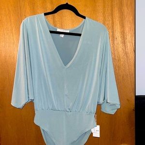 Woman’s 3/4 sleeve body suit
